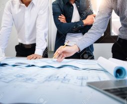 Image of engineer meeting for architectural project. working with partner and engineering tools on workplace.